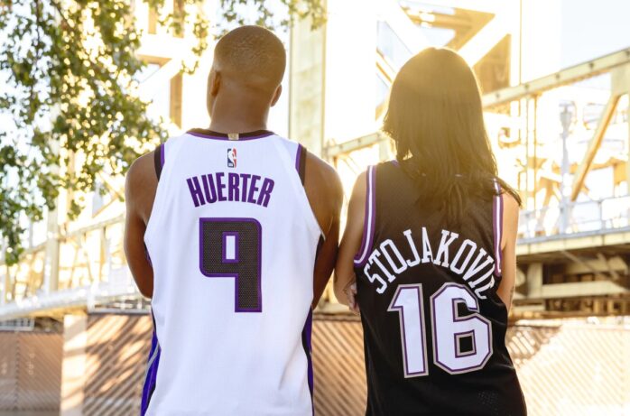 Two Fans Wearing Sacramento Kings Jerseys. Concept for Basketball Gear